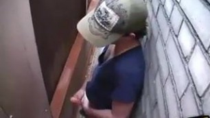 Horny dude wanking his dick in the back of the alleyway